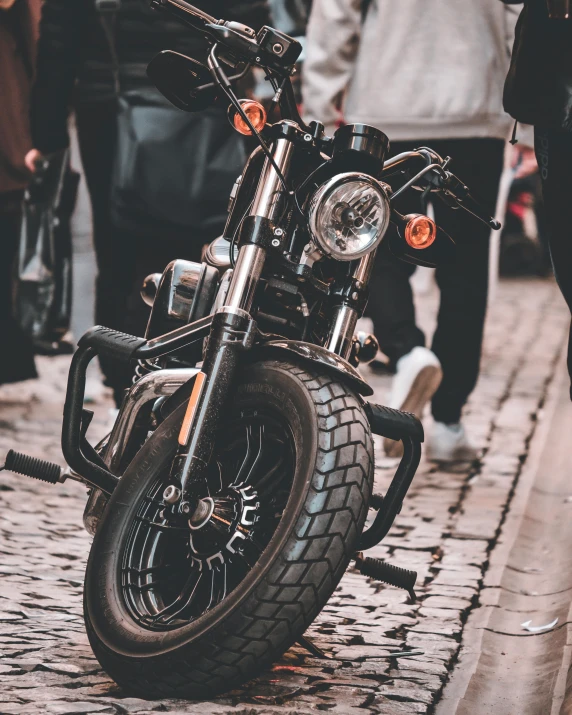 a black motorcycle parked on the side of a street