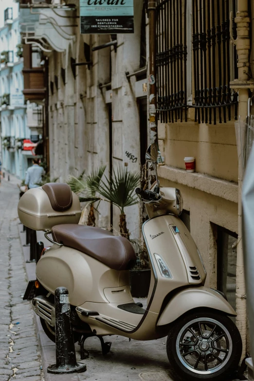 there is a scooter that has a motor bike parked on the side