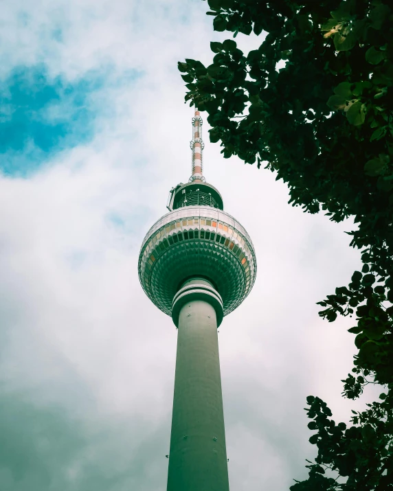 a very tall tower in the middle of some trees