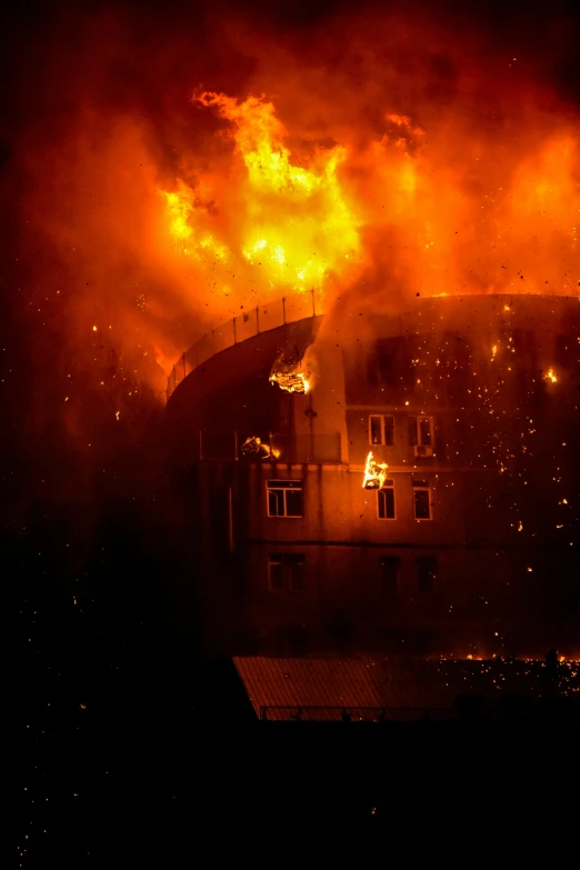 the scene of an emergency in a house during a large blaze