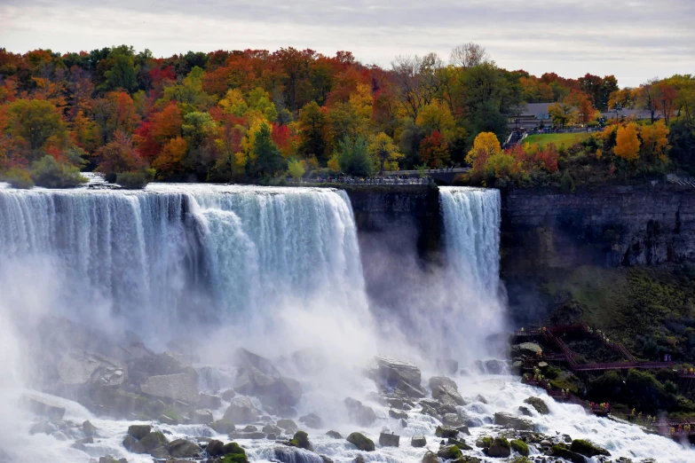 a very large waterfall with some water pouring out of it