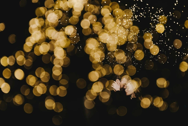 blurry lights of small white flowers in the dark