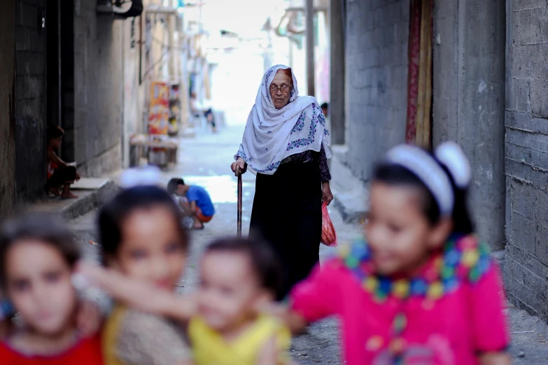 an old woman walking down a crowded street