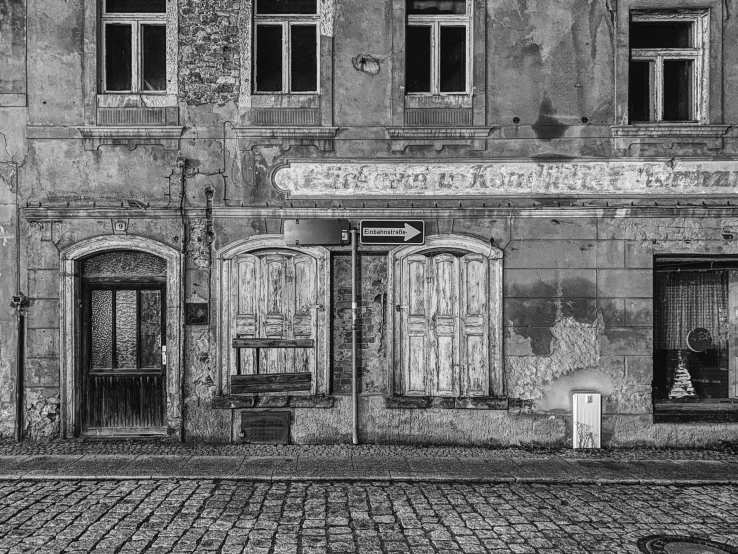 the two old doors are closed outside of the building