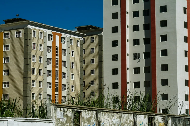 buildings and concrete walls are on the side of the road