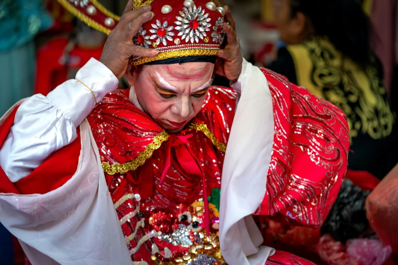 a woman with very many types of attire has a face mask