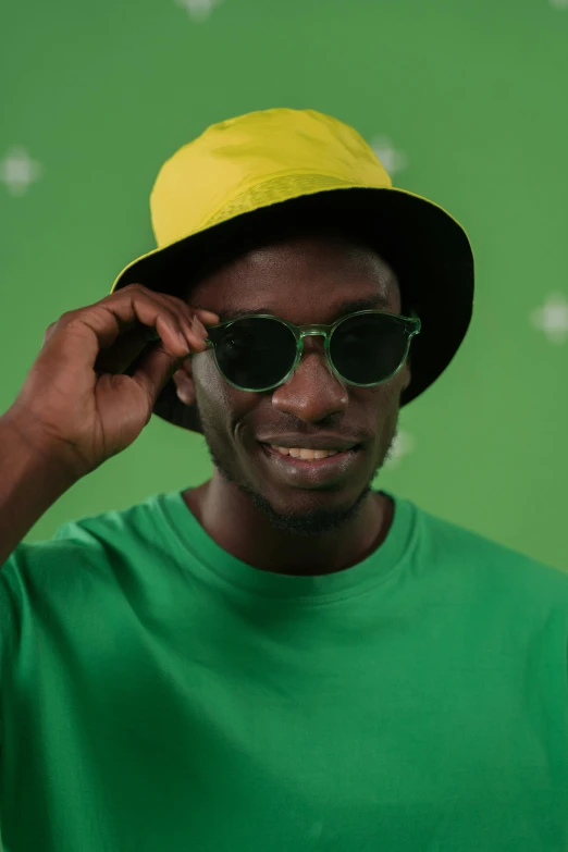 a person wearing a green shirt and a hat