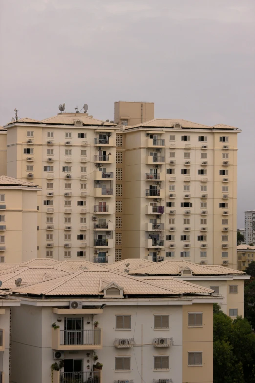 a tall building is shown with balconies in the background