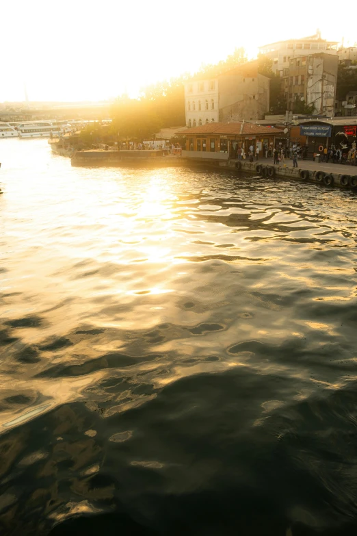 a body of water surrounded by buildings and a dock