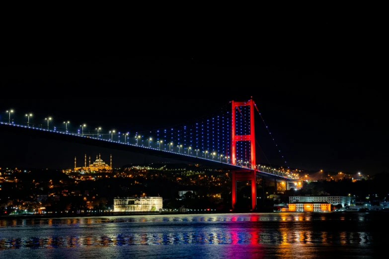 the colors of this bridge are dazzlingly bright at night