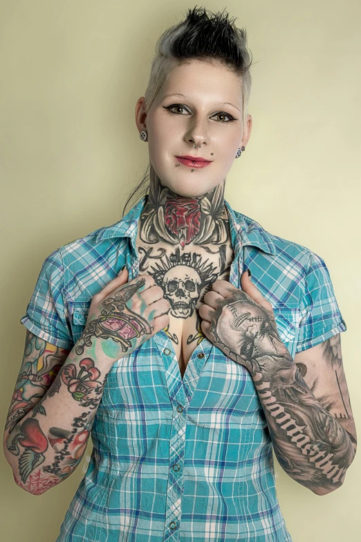 a woman with tattooed hands posing for a po