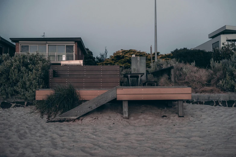 a bench and stairs on the side of a building