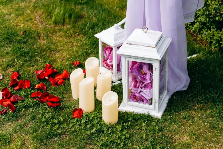 a candle and other items placed on the ground