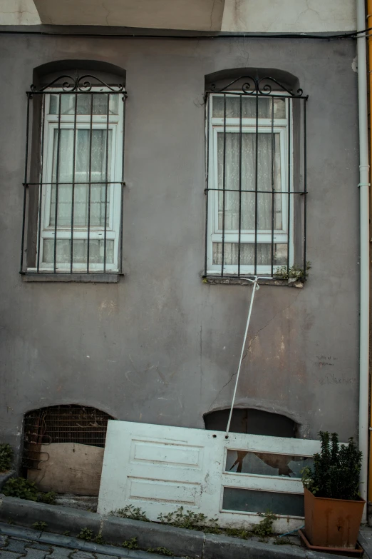 the entrance of a building that has a broken window