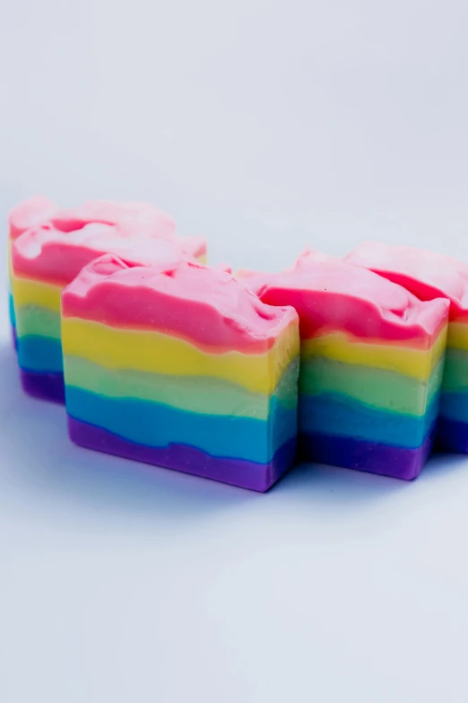 small rainbow colored square shaped squares that form like hearts