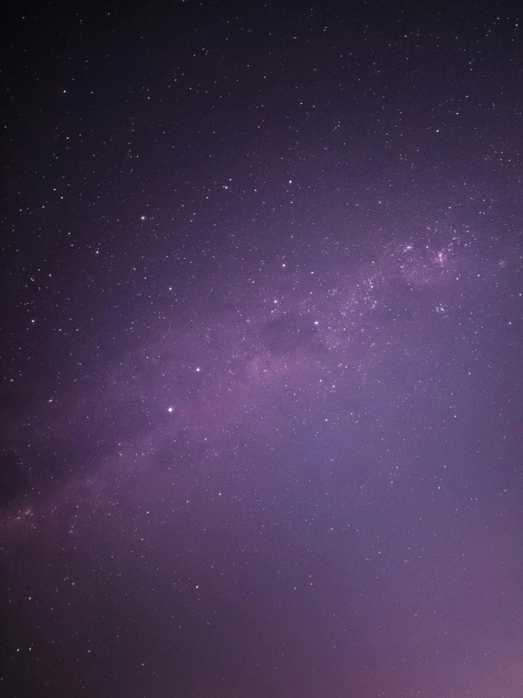 some dark purple clouds and the milky in a dark sky