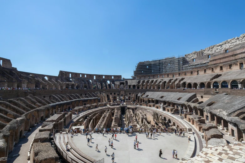 a group of people are standing around a giant building