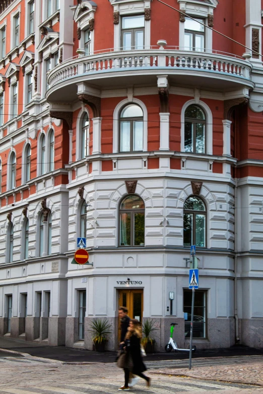 an old building sitting in the middle of a street