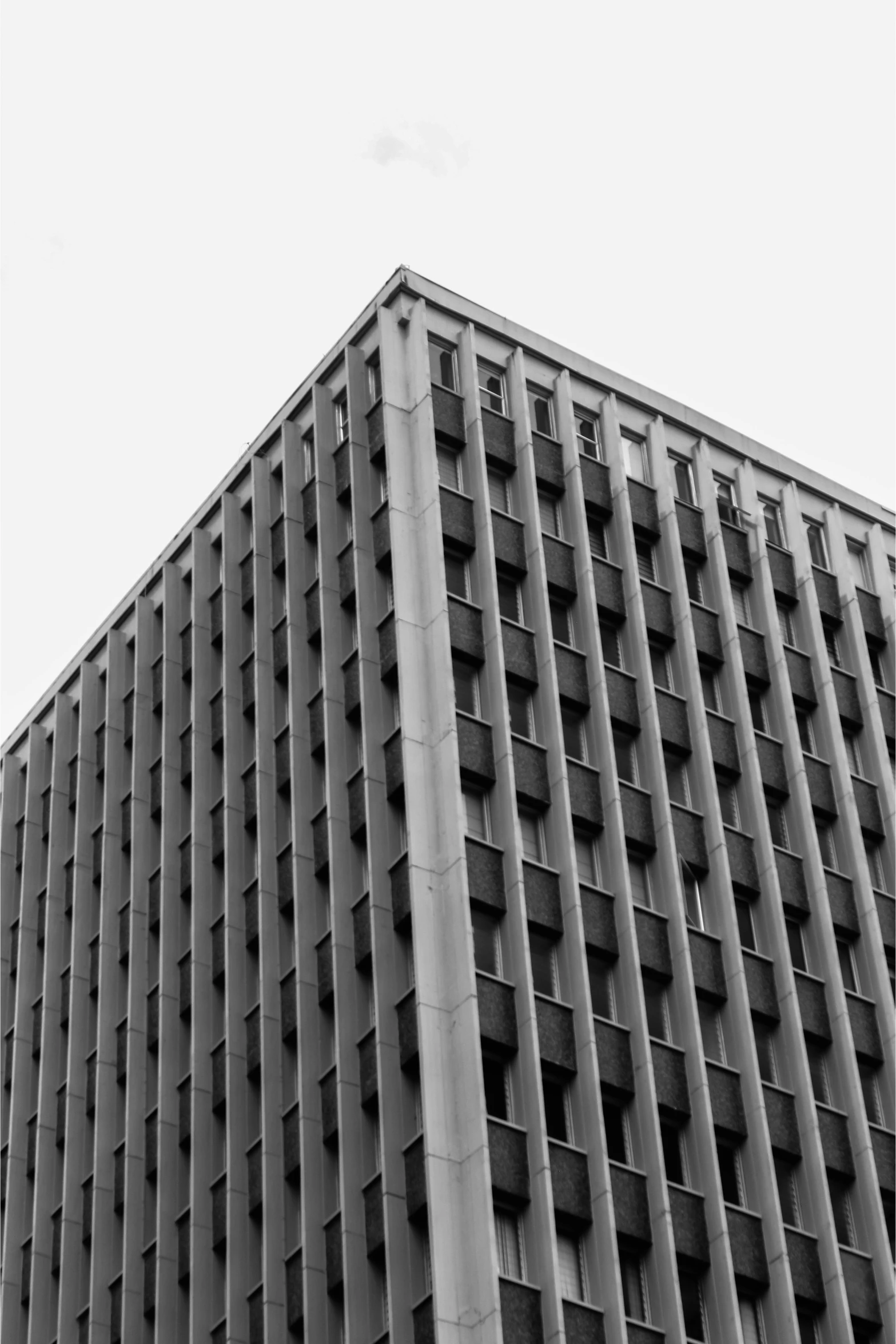 a very tall brick building with lots of windows