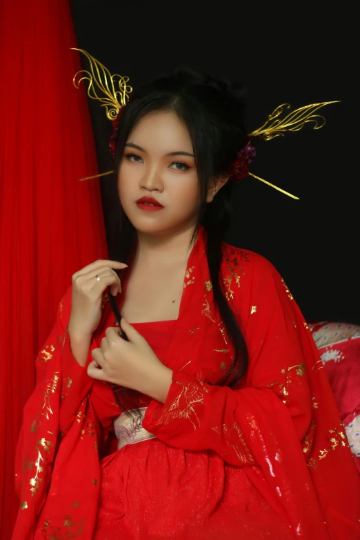 a woman in red dress posing for a pograph