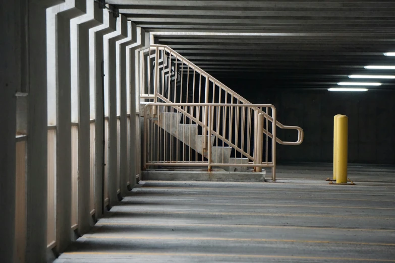 some metal railings inside a long building