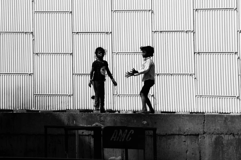 the silhouettes of skateboarders talk to each other