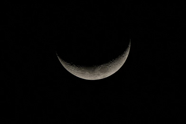 a crescent moon with a black background