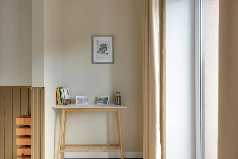 a wooden stool in a corner of the room