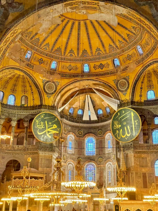 the interior of a large church with colorful paintings