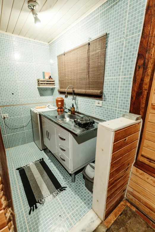 a bath room with a toilet and a sink