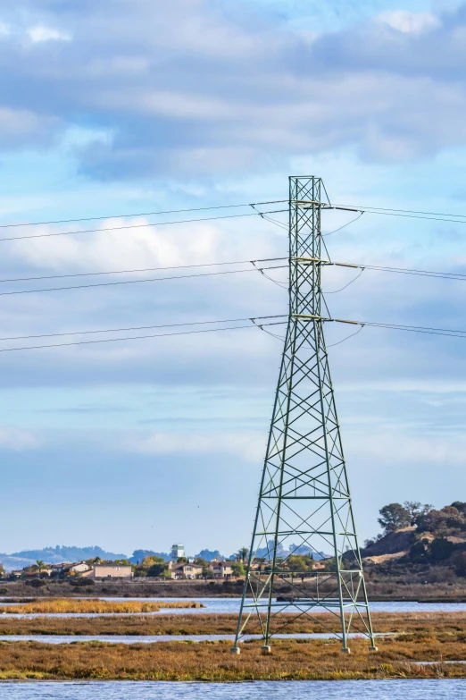 a big tower with many birds in the sky