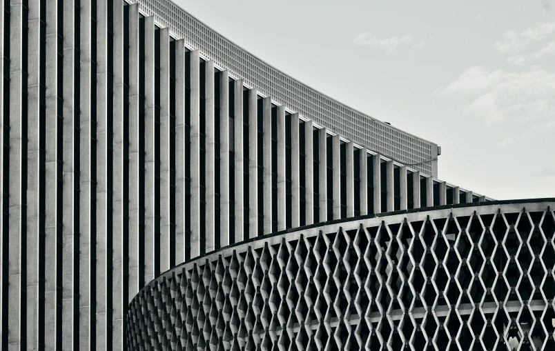 curved building with a large wavy window pattern on the side