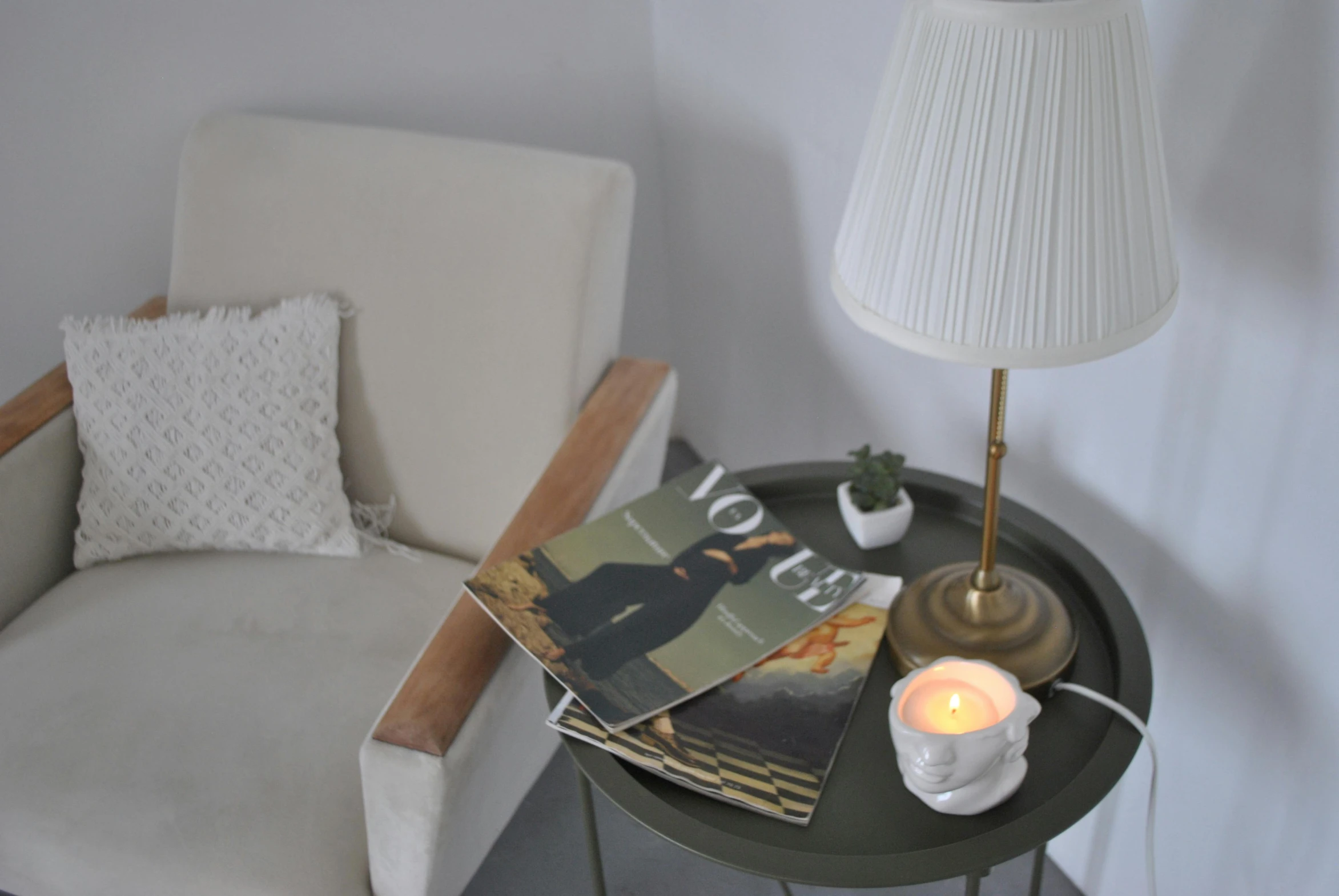 a close up of a table with books and candles