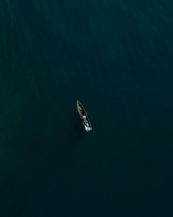 a sailboat is floating across a large body of water