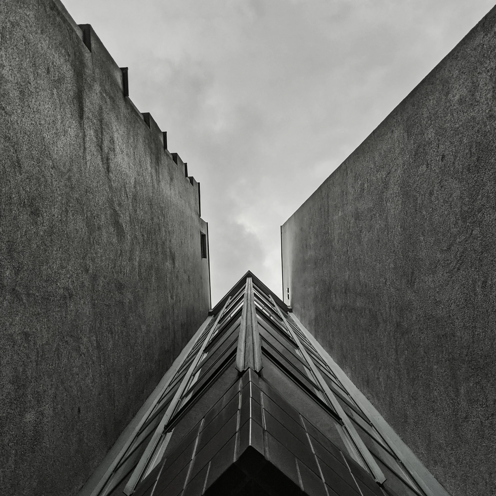 black and white pograph of the corner of two buildings