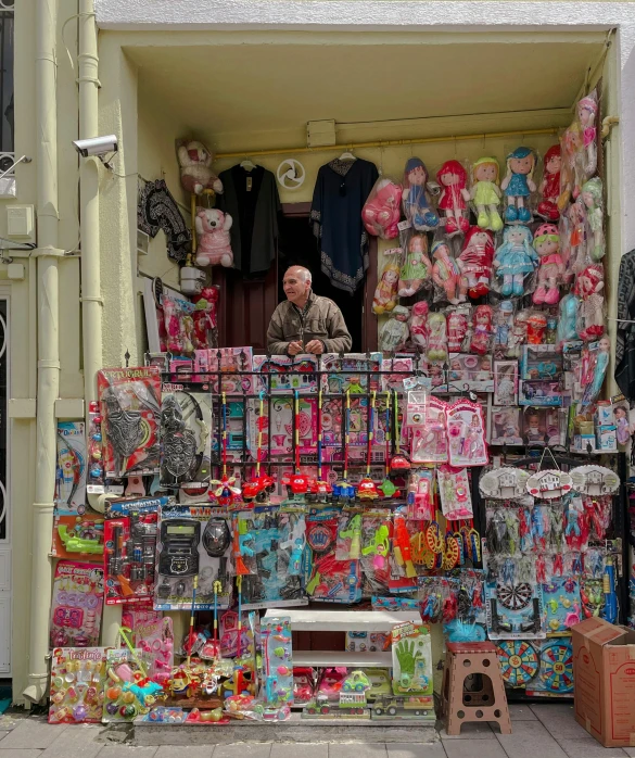 there is a booth selling toys and items in the street