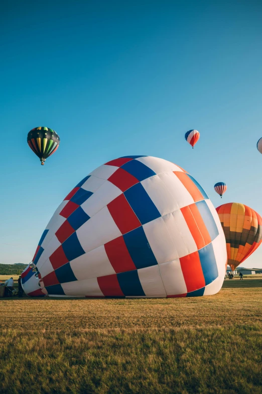 a bunch of balloons are floating across the sky