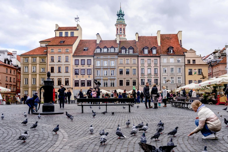 people gather around the square on a cloudy day