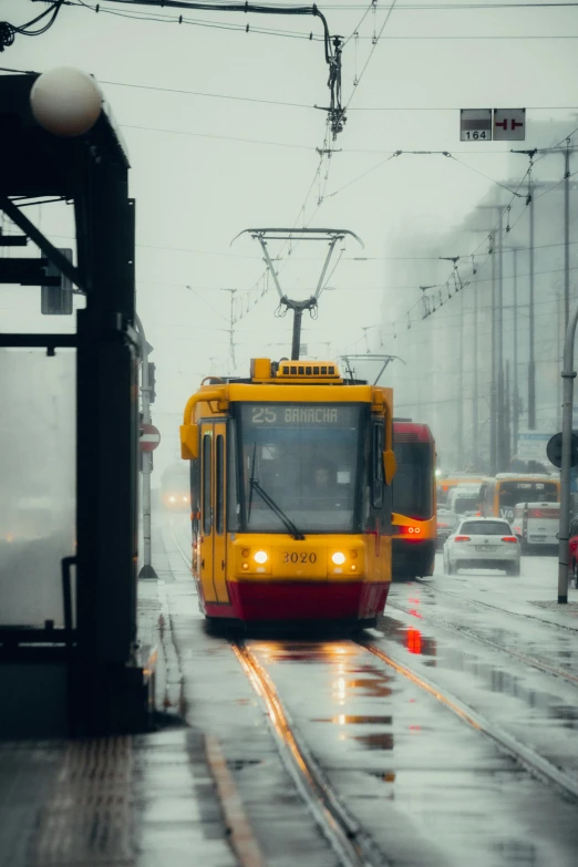 a train pulling into the station during a storm