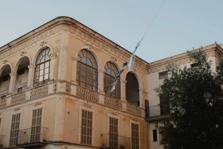 a very large building with lots of windows and balconies