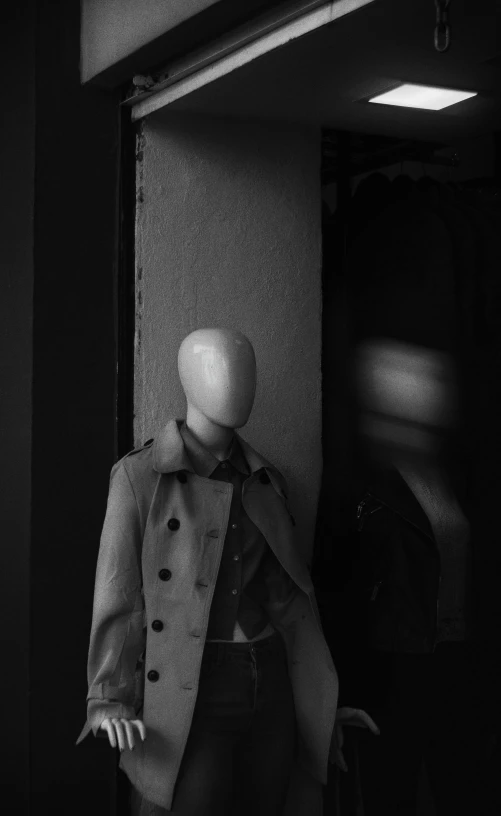 a mannequin heads are shown on the front door of a shop