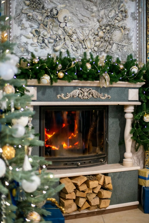 a decorated mantle filled with christmas decor around a fire