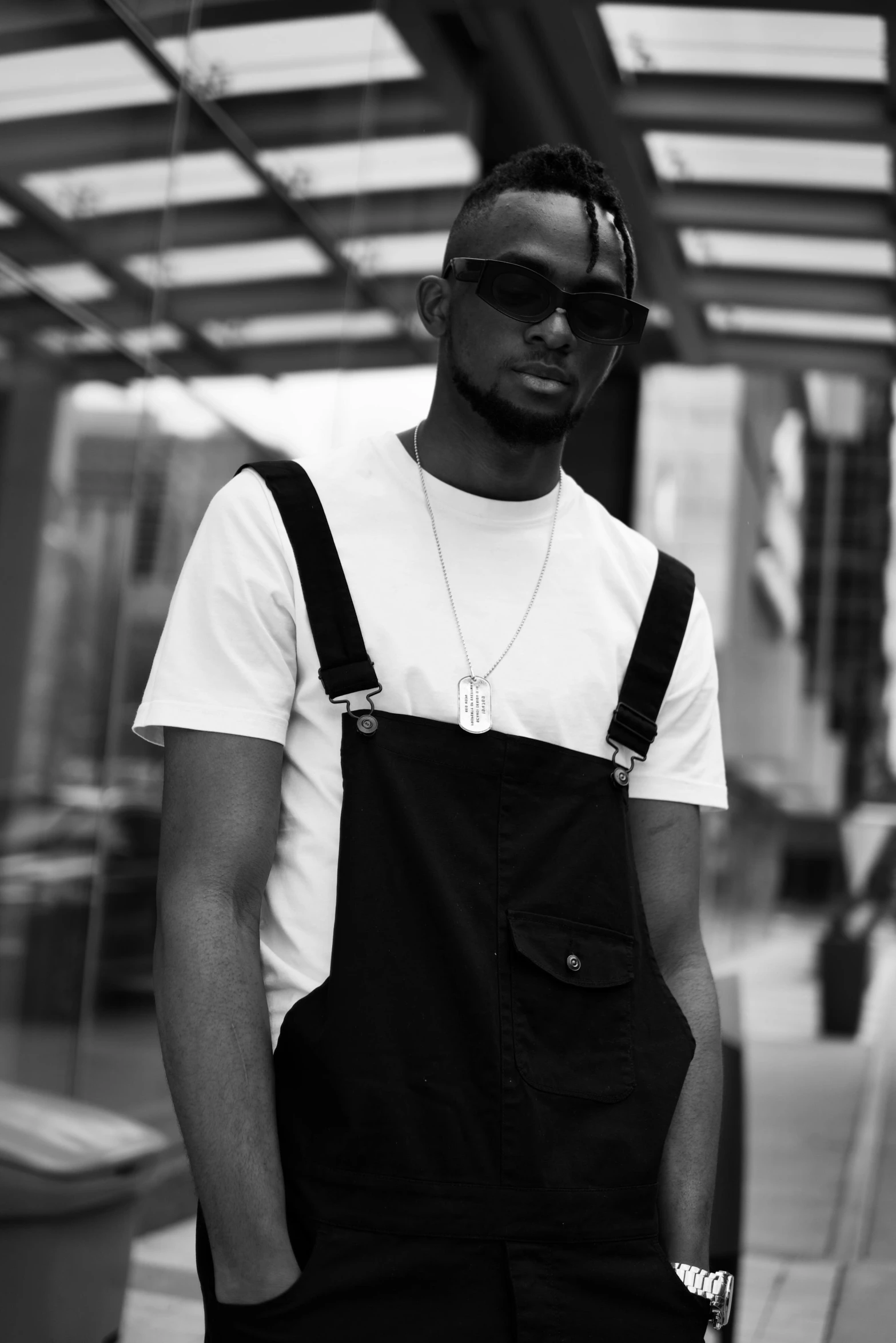 a young man in an apron wearing sunglasses