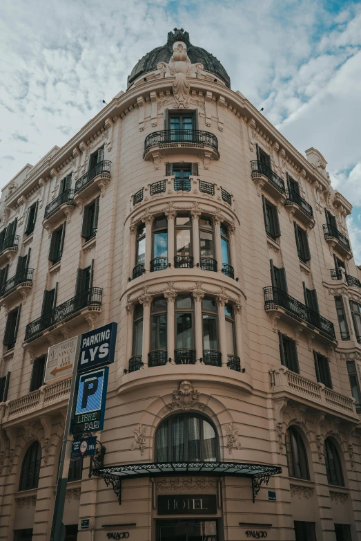 an old brown building sitting on the corner of a street