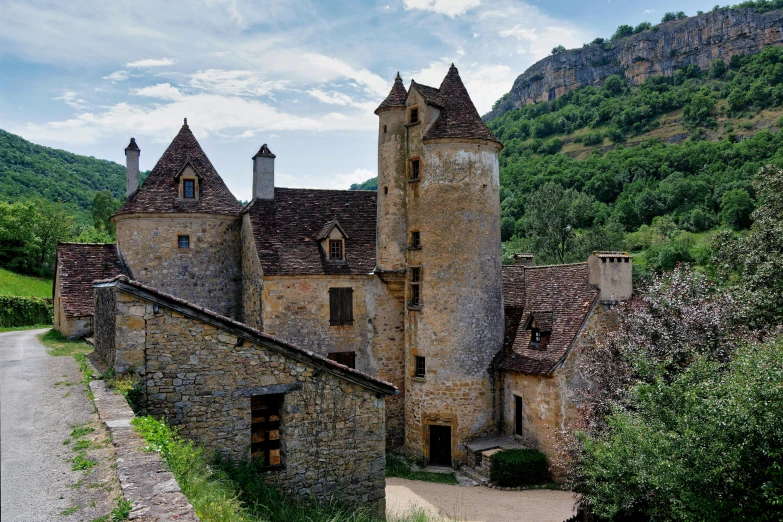 a very old castle surrounded by a mountain