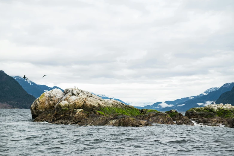 an island with many rocks on it and some water