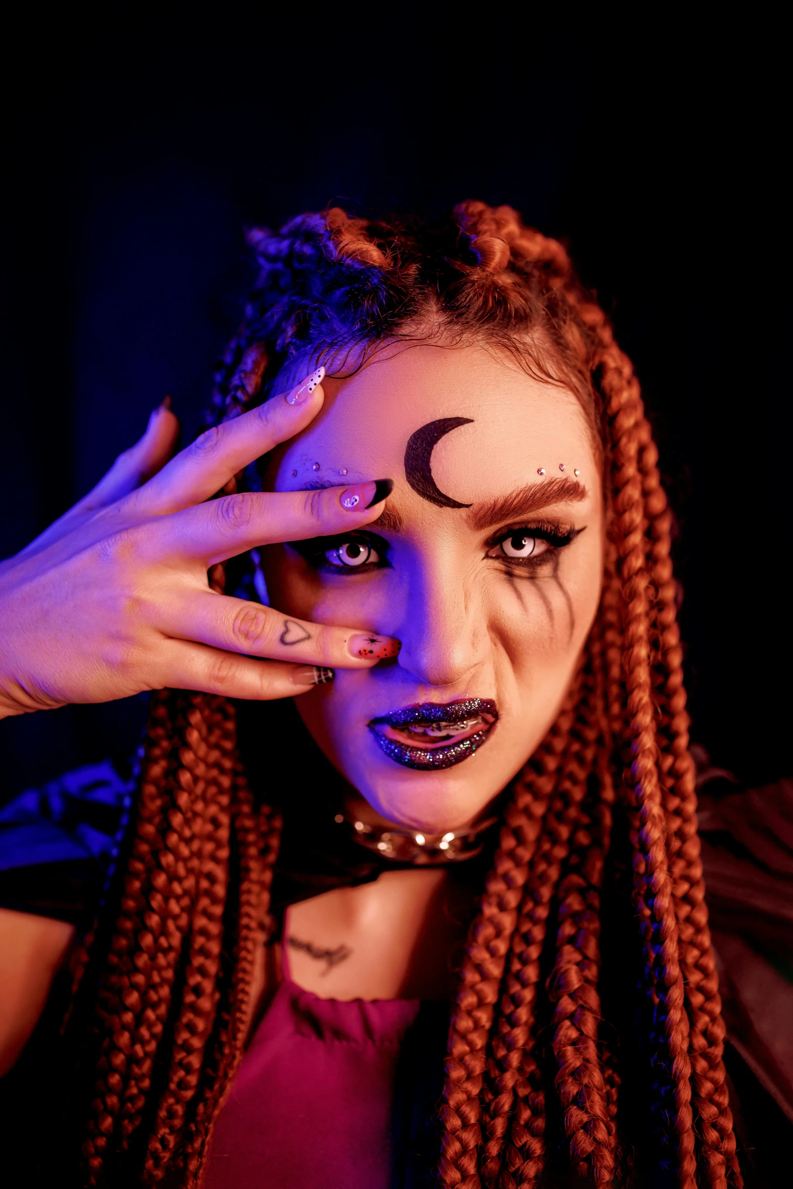 woman with make up for halloween on face and hands