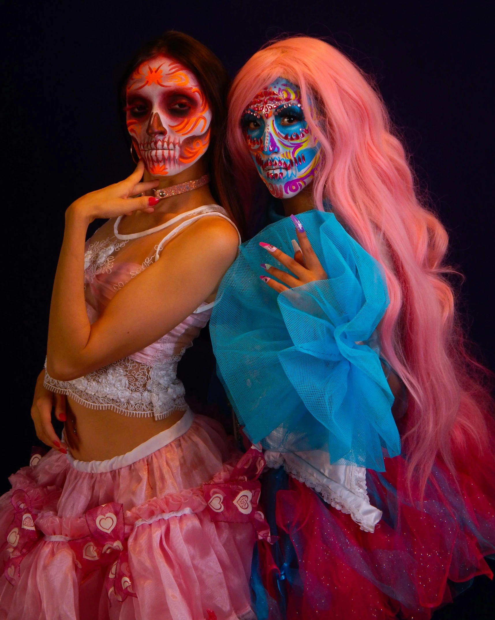 two beautiful women dressed up in costumes