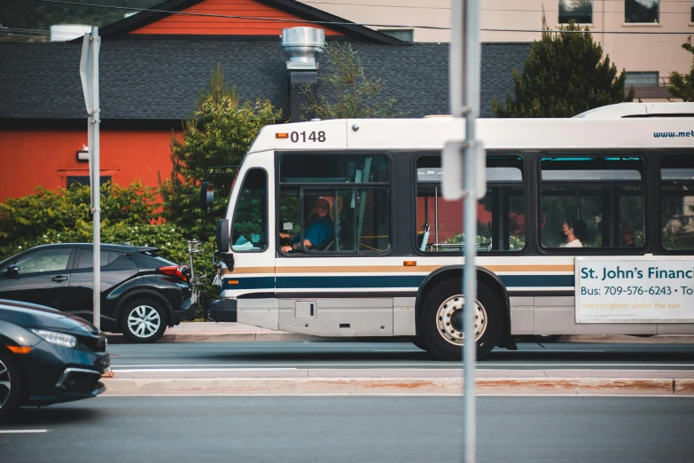 a passenger bus is traveling down the road