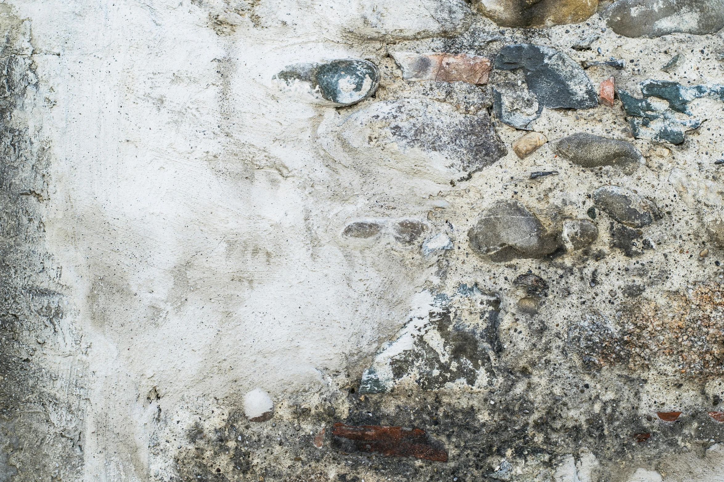 a background with dirt and stone rocks that appears to be cement